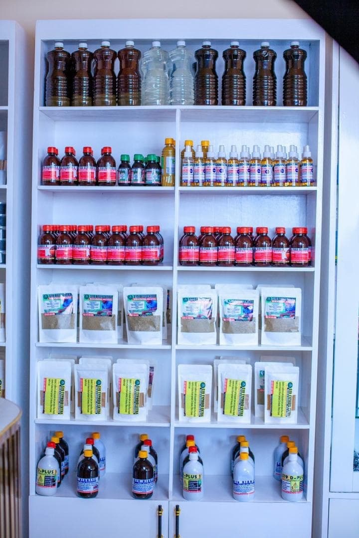 Shelves of S19 Herbal Clinic herbal products, medicinal teas and supplements in the Bafoussam clinic dispensary